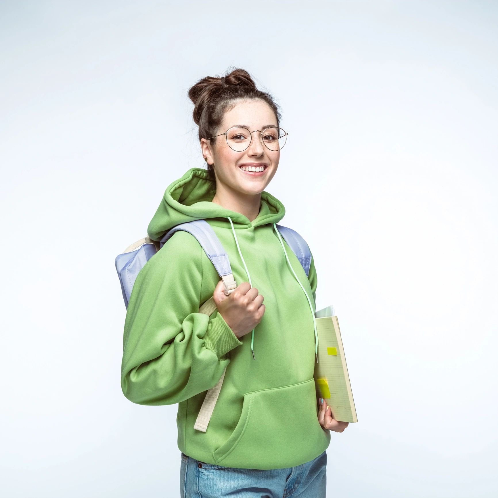 Portrait of a teacher with books and backpack