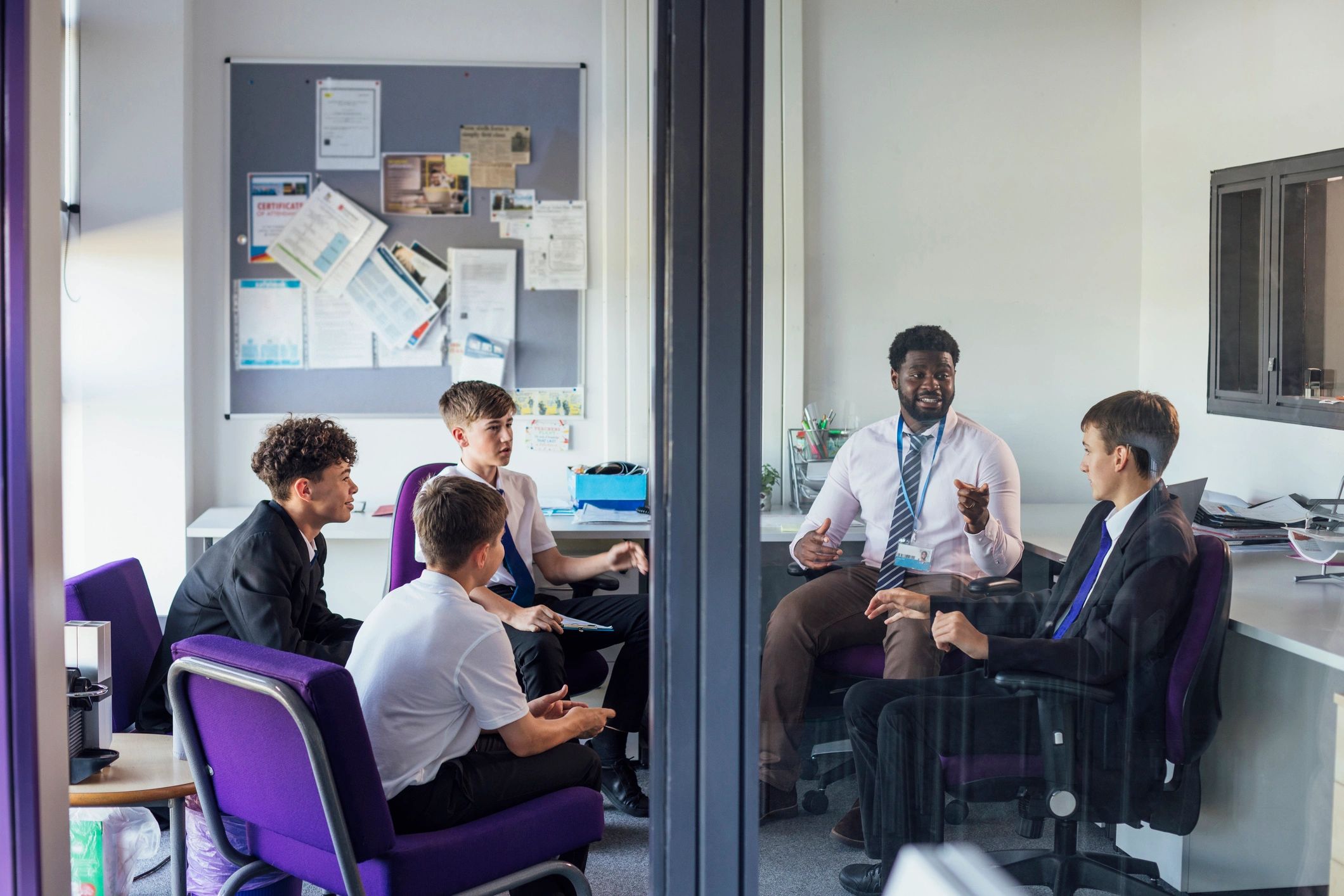 Students meeting with teacher