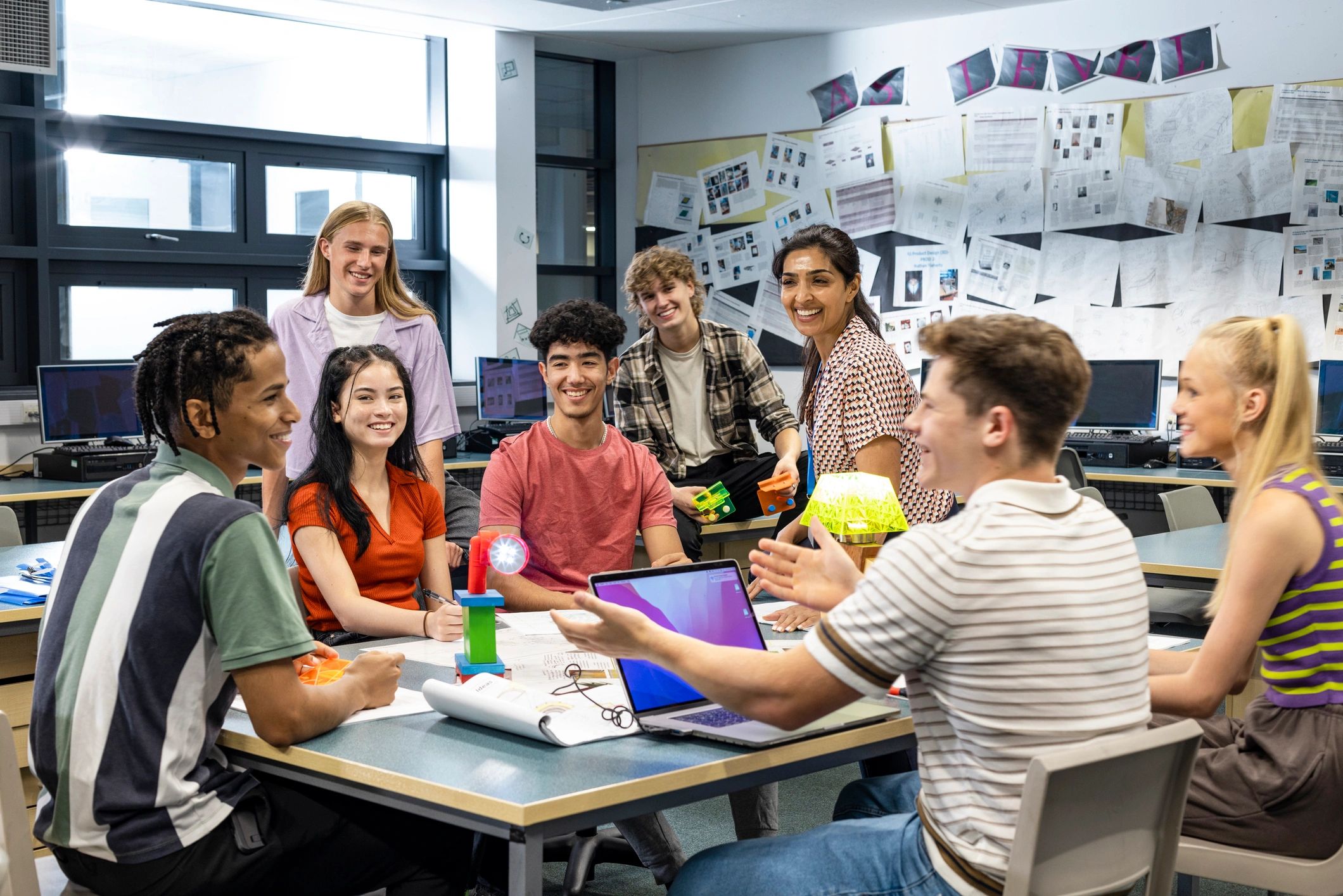 Teacher leading an engaged small-group classroom discussion